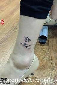 Small crown tattoo on the ankle