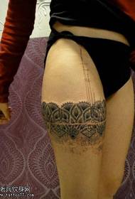Lace tattoo on the thigh