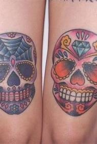 Froulike skonken kleurde skull tattoo-ôfbyldings