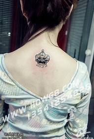 Small crown tattoo pattern on the back