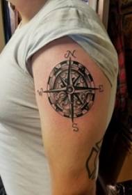 Girl arm on black gray sketch creative literary retro compass tattoo picture