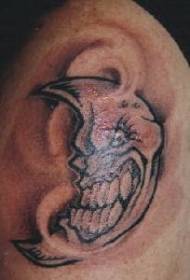 Na ramenu smeđa ljuta humanizirana mjesečeva tetovaža