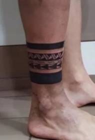 8 black totem arms and leg ring tattoos