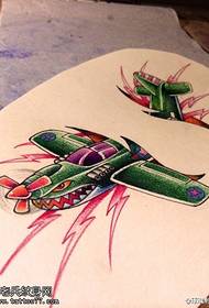 Patrón de manuscrito de tatuaje de avión de color proporcionado por tattoo show