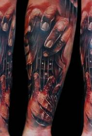 Arm tearing skin style colored bloody hand with guitar tattoo