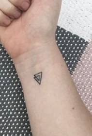 Schoolboy arm on black line geometric element creative triangle tattoo picture