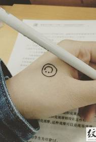 Simple little smiley face tattoo