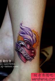 Girl's legs beautiful colored love flame tattoo pattern