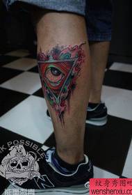 A triangle eye tattoo pattern that is very popular in the legs.