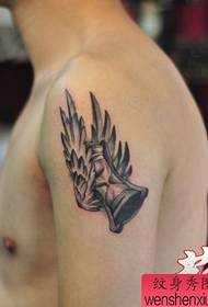 One arm wing hourglass tattoo pattern