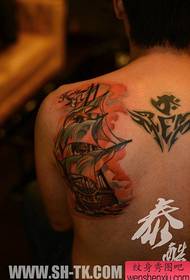 A classic sailing tattoo on the shoulder