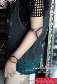 Girl's arm classic alternative puppet joint tattoo pattern