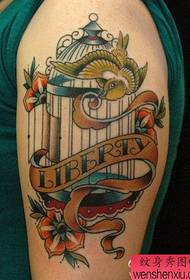 Arms with a European and American style bird and birdcage tattoo pattern