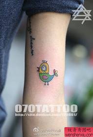 A personalized chicken tattoo on the arm