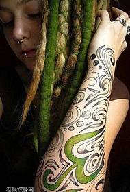 color totem tattoo pattern on the arm