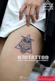 a popular owl tattoo on a beautiful thigh
