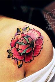 a woman's shoulder rose tattoo pattern