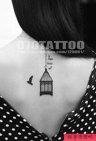 a delicate bird cage tattoo pattern