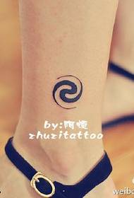 spin totem tattoo pattern on the ankle