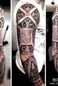 Tali acara tato nyaranake pola tato lengen kembang mekanik kanthi pola