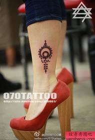 sexy girl's ankle at a small fresh tattoo pattern