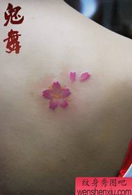 girl's back shoulder pop small cherry blossom tattoo pattern