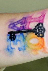 girl's arm beautiful small key and letter tattoo pattern