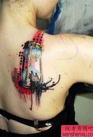 en personlighet på baksidan av en personlighet timglas tatuering fungerar