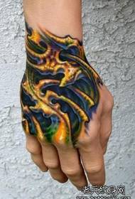 A colorful 3D tattoo pattern on the back of the hand