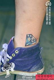 a small and beautiful small diamond tattoo pattern on the leg