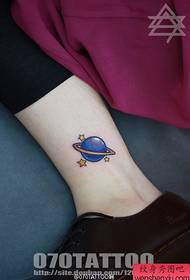 a stream of planet ball tattoo on the sister's ankle