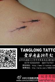 Small and popular ink small koi tattoo pattern on the shoulder of the girl