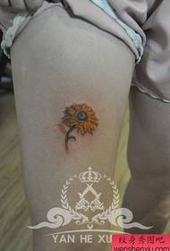 girl's leg colored small sunflower flower tattoo pattern