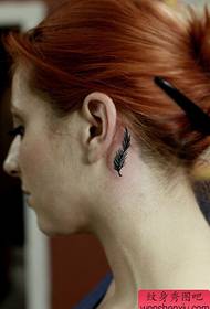 girl's ear black feather tattoo pattern