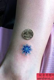 girl's leg nice small snowflake tattoo pattern