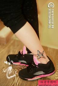 Beautiful and popular starry five-pointed star tattoo pattern at the girl's ankle