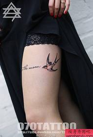 sexy beauty on a thigh on a swallow tattoo pattern