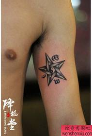 a pentagram and gossip tattoo on the inside of the arm