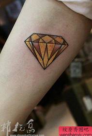 popular small diamond tattoo pattern on the inside of the arm