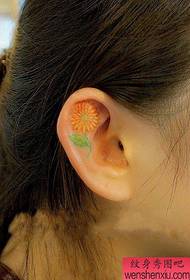girl's ear small floral tattoo pattern
