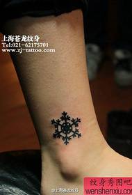 girl's ankle at the popular fashion snowflake tattoo pattern