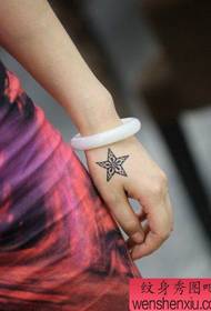 girl's hand beautiful looking five-pointed star tattoo pattern