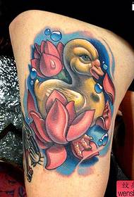 a gorgeous cute little yellow duck tattoo on the thigh