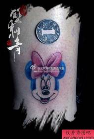 a small and popular Mickey Mouse tattoo pattern in the leg