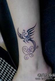 a girl's leg a totem phoenix tattoo pattern