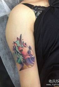girl arm with a unicorn and ice cream tattoo pattern