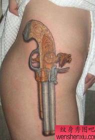 Japanese female leg pistol tattoo