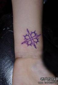 simple and beautiful color totem tattoo pattern on the girl's wrist