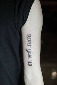 hidden in the inner side of the arm English word tattoo picture