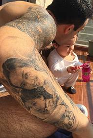 warm pattern tattoo on father's arm